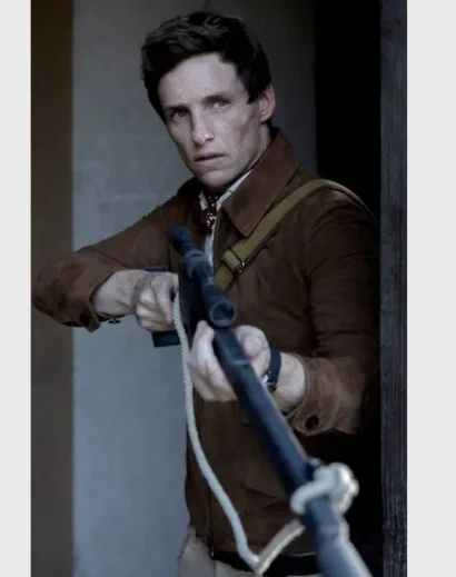 Eddie Redmayne's classic brown suede jacket paired with casual trousers in The Day of the Jackal