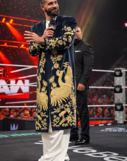 golden-peacock-long-coat-arena-entrance Golden peacock long coat styled with white trousers in arena entrance