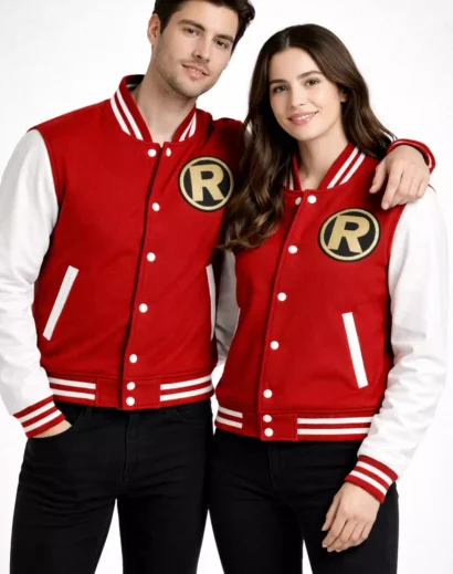 Couple wearing matching red and white varsity letterman jackets standing together