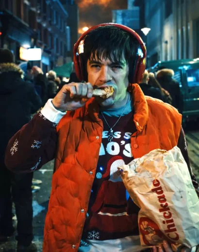 mens-orange-puffer-vest-roddy-ho-slow-horses-inspired men's orange puffer vest inspired by roddy ho slow horses puffer jacket front standing pose