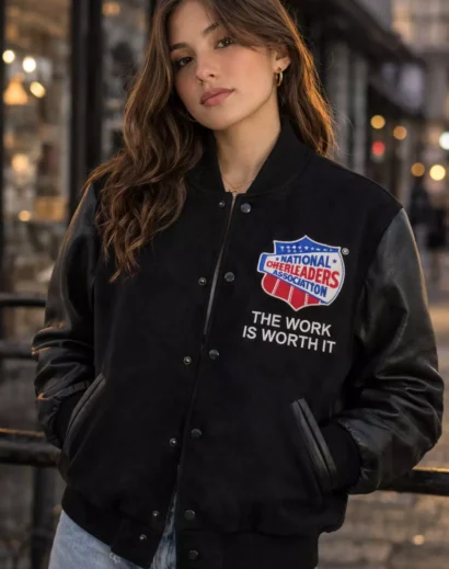 nca-national-champion-varsity-jacket-front-view Front view of NCA National Champion varsity jacket with black wool body and leather sleeves, embroidered National Cheerleaders Association patch.