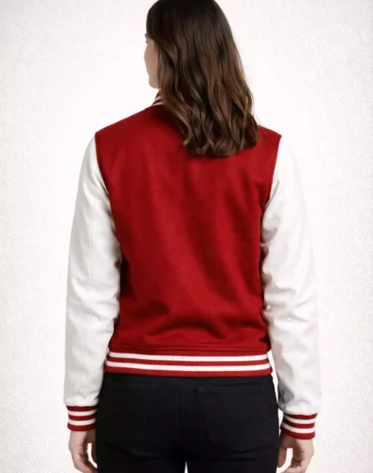 Back view of woman wearing red and white varsity letterman jacket