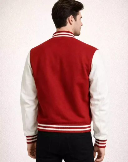 Back view of men wearing red and white varsity letterman jacket with striped ribbed hem