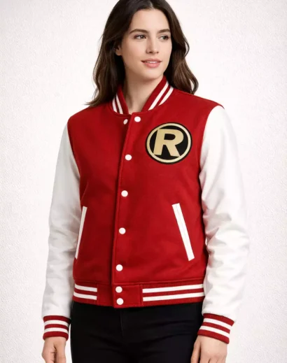 Woman wearing red and white varsity letterman jacket with leather sleeves and ribbed cuffs