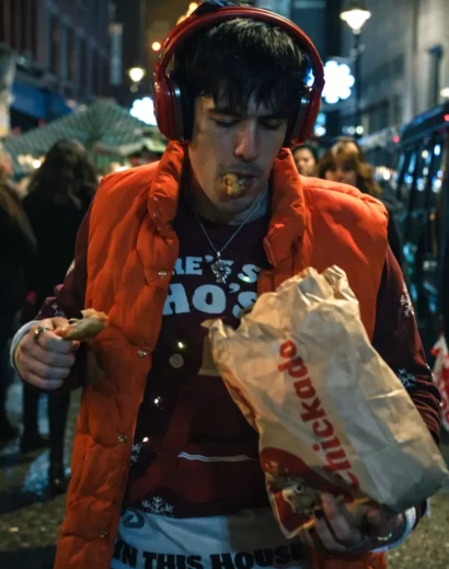 roddy-ho-headphones-slow-horses-puffer-vest-street-style Roddy Ho headphones wearing roddy ho slow horses puffer vest while eating on street scene