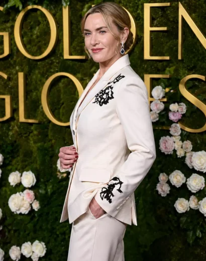 Kate Winslet white suit side profile featuring a black and white floral tuxedo outfit with a modern tailored fit