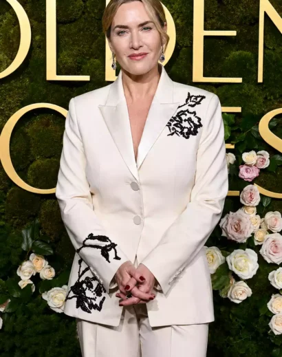 Kate Winslet rocked this black and white floral suit in a front view, showcasing her elegant white tuxedo outfit with floral detailing