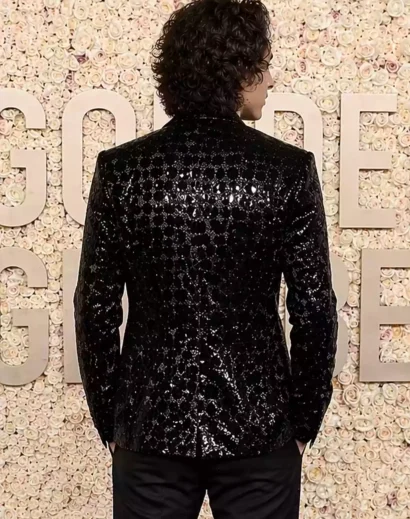 Timothee Chalamet sparkles in black coat sparkle sequin jacket from back view