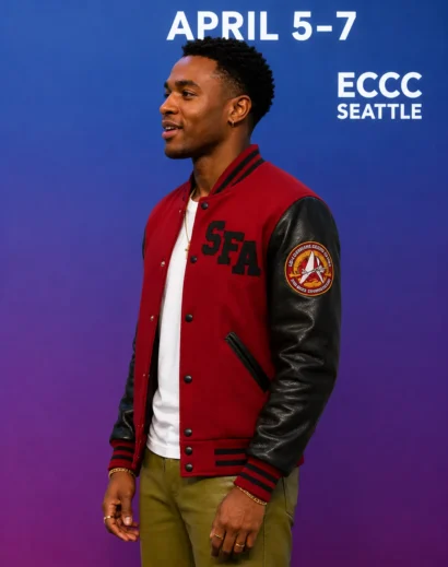 karim-diane-jacket-left-side-profile Left side profile of the Karim Diane Jacket from Star Trek: Starfleet Academy, highlighting the detailed sleeve patch and varsity jacket design.