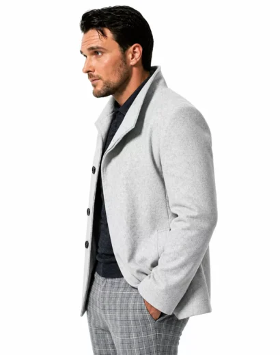 Left side profile of the Extant TV Series White Coat worn by Dr. Mason, highlighting the premium craftsmanship of the Owain Yeoman jacket with its sleek wool construction and stylish collar design.