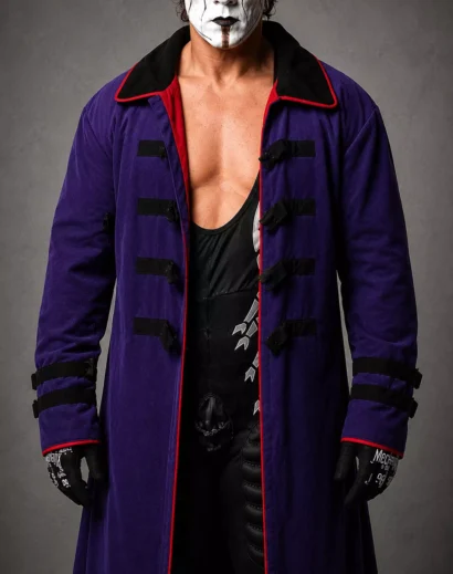 Close-up detail of the Sting Purple Coat featuring premium craftsmanship, black buckle accents, and a men's long purple jacket inspired by the Sting trench coat.