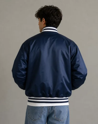 Vintage MLB New York Yankees Starter Jacket back view on male model showing classic satin construction, ny yankees vintage 90s athletic jacket style, blue varsity jacket men.