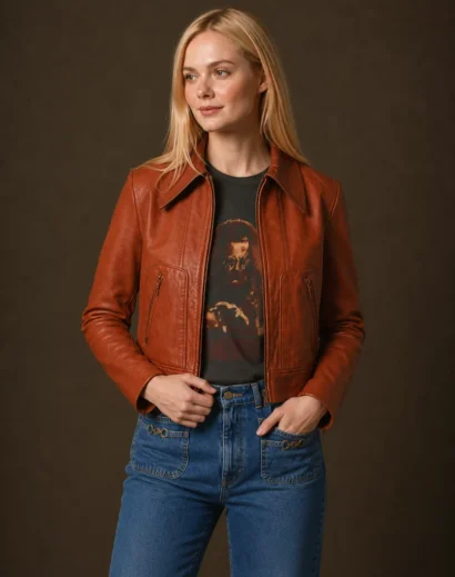 Margo’s Got Money Troubles Event Elle Fanning Margo Millet Orange Jacket worn in a front pose. Inspired by the SXSW 2026 Elle Fanning Red Leather Jacket, this cognac brown leather jacket women style blends women's cafe racer leather jacket fashion with timeless women leather jackets.