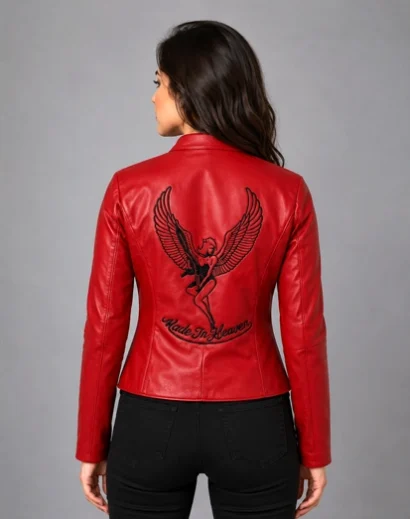 RE2 Claire Leather Jacket with detailed black winged back artwork and Made In Heaven lettering, styled as a women’s biker leather jacket for Resident Evil cosplay and gamer fashion.