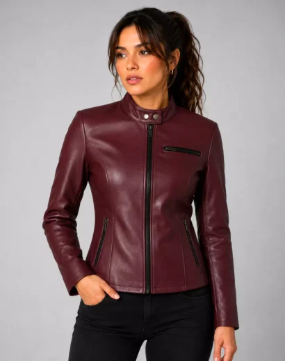 RE2 Claire red leather jacket front view on female model, showcasing the fitted biker silhouette, stand collar and classic motorcycle jacket details