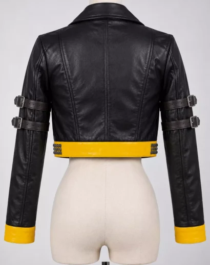 Back view of woman wearing a black and yellow cropped leather motorcycle jacket with buckle sleeve details
