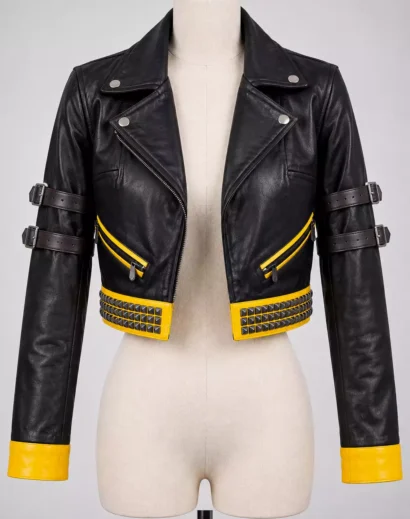 Front view of womens black and yellow leather moto jacket with cropped fit, yellow cuffs and studded detailing