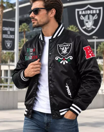 Man modeling a skull rider jacket with black satin finish, embroidered patches, and varsity bomber styling