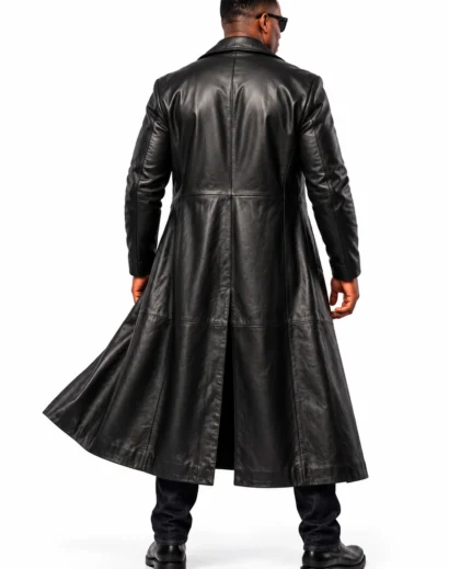 Back view of a men's black tactical costume showing the leather vest's central riveted panel, shoulder straps and black cargo trousers.