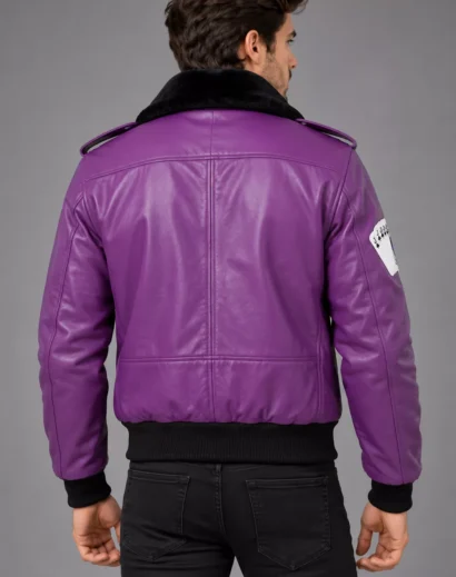 Unique purple leather bomber jacket for men with a black fur collar and decorative patches.