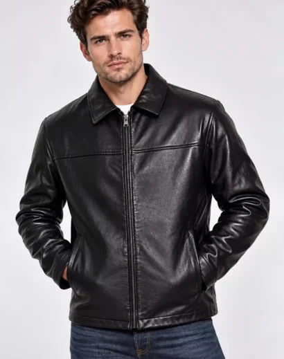 mens-textured-black-leather-jacket-premium-stitching-detail Close-up of a men's textured black leather jacket highlighting the smooth leather surface, premium stitching, classic folded collar, sleeve construction and handcrafted-style detailing.