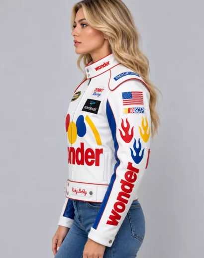 womens-ricky-bobby-jacket-left-side-profile Women's Ricky Bobby movie jacket in left profile, showing the racing-style collar, blue sleeve panel, flame graphics, and red piping. Copy filename + alt text